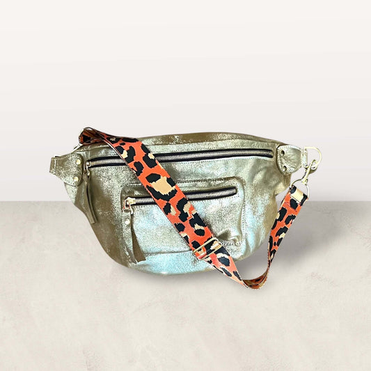 Heavy Metal Gold Crossbody Bag with leopard print strap and multiple zipper pockets, showcasing quality and beauty.